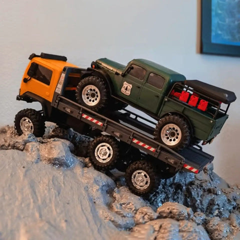 Six Wheel 6x6 RC Rock Crawler V1.5 1/18 Scale All Terrain Off Road Ready To Run with green and yellow trucks on rocks