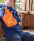 Individual using Yosemite Map Survival Bandana And Grab-and-Go Emergency Navigation Scarf as a tourniquet, blaze orange bandana.