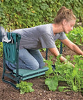 Person using Foldable Garden Kneeler And Tool Tote Portable Seat And Storage Bag With Multiple Pockets Hanging Organizer For Tools Gardening Stool Durable 600D Oxford Cloth Purple.