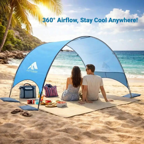 Couple under UPF 50 Plus Beach Tent Canopy With 360 Degree Ventilation Portable Sun Shade on beach with picnic setup.