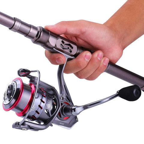 Close-up of a hand holding a Telescopic Fishing Rod For Travel And Bass And Trout Angling With 24T Carbon Fiber Construction