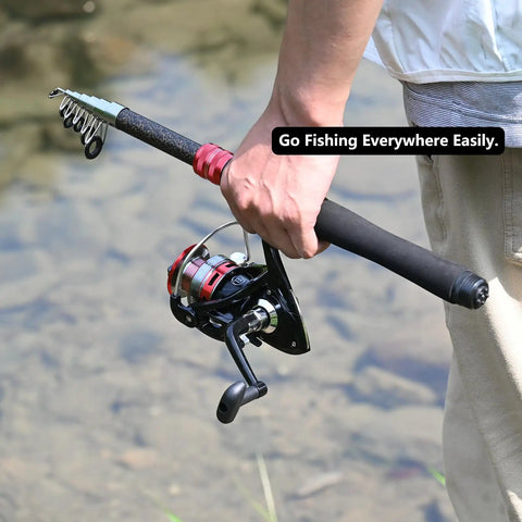 Person holding Telescopic Fishing Rod And Reel Combo Six Point Nine Feet All In One Includes Pliers Lip Gripper Spare Line Lures Hooks Carrier Bag And Spinning Reel For Bass Saltwater Freshwater Fishing Portable Travel Friendly Collapsible Kit by a river.