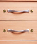 Top Shelf Brass Decorative Screws 24 Pack 15Mm Upholstery Tacks on drawer with silver handles and brass caps.