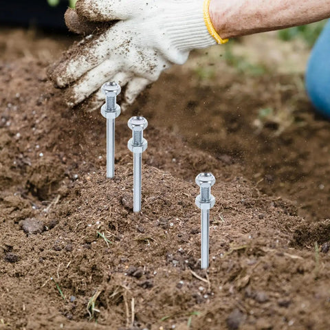 Heavy Duty Lawn Aerator Spikes 10 Pack Replacement Pegs for Lawn Shoes in soil, close-up view.