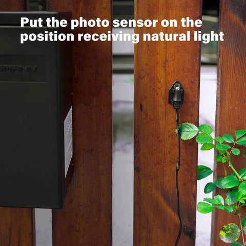 Photo Eye Light Sensor For Power Pack Transformers, Dusk To Dawn Auto On Off Switch installed on a wooden surface outdoors.