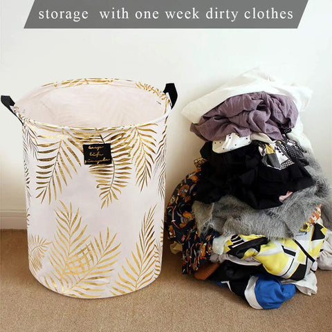 Collapsible Laundry Hamper Basket With Handles Waterproof Liner Round Cotton Linen Fabric next to a pile of clothes