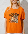 Woman wearing orange shirt with Team Punchs Iron On Transfers 6 Pack 7x7 Inch DTF Heat Press Stickers design of hugging animals.