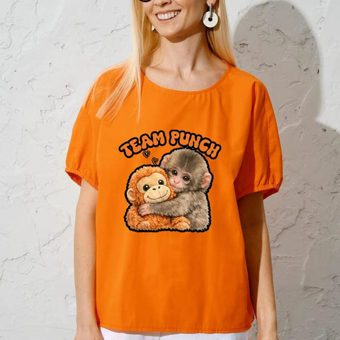 Woman wearing orange shirt with Team Punchs Iron On Transfers 6 Pack 7x7 Inch DTF Heat Press Stickers design of hugging animals.