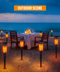 12 Pack Solar Outdoor Lights Extra Bright Solar Torch Lights With Dancing Flickering Flames Lit for beachside dining scene
