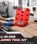 Flexzion brake line flaring tool kit in red open case with tubing cutter on a wood workbench.