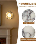 Alabaster Wall Sconce, 7.5" Natural Marble Wall Lamp with Milk Glass Shade displayed on a wall with unique stone details.