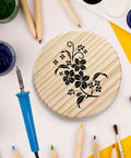 Dicunoy 4-inch round unfinished wood coaster with black floral design, front view