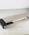 Close-up of Beast Of A 13 Inch Laminate Flooring And Siding Cutter with sliding extension table holding a laminate plank.