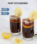 Two drinks with ice cubes and lemon slices showing quick bullet cubes for Heavy Duty Countertop Ice Maker With Integrated Handle Generating Quick Bullet Cubes In Minutes Yielding 26 Pounds Daily For No Sweat Hosting And Slick Kitchen Organization.