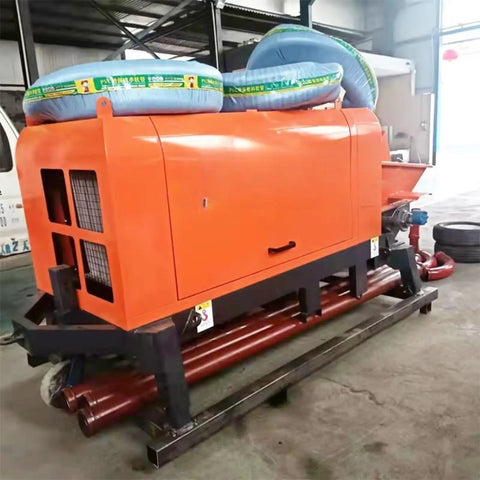 Heavy Duty Concrete Transfer Pump For Construction Sites Built Tough To Move Slurry Fast With Gate Valve, Delivery Equipment, And Custom Pipeline Extensions For Logistics Parks And Warehouse Projects Pro Grade. orange concrete transfer pump with hoses and steel base in workshop