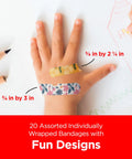 Child's hand with two decorative adhesive bandages in assorted sizes from Totally Kid Approved Marvel Themed Bandages For Minor Scrapes And Cuts.