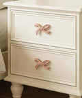 Bow Shaped Dresser Knobs 10 Pack Pink Zinc Alloy Drawer Pulls on white dresser cabinets
