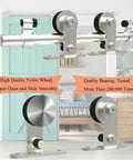 5.5 Foot Stainless Steel Sliding Barn Door Hardware Kit With Top Mount Heavy Duty Track System For Single Wood Door T Style Barn Door Hardware Set Corrosion Resistant Smooth Quiet Operation Durable Construction shown installed in living room