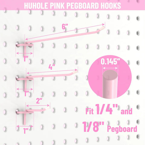 Pink Pegboard Hooks 2 Inch Set With Rubber Safety Tips, Heavy Duty Metal Hangers That Stay Put, Fits 1/8 And 1/4 Inch Boards, 50 Pack displayed on pegboard