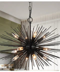Black Sputnik Starburst Chandelier With 12 Lights 24 Inches Mid Century Firework Pendant Light Fixture For Dining Room Kitchen Island And Living Room Solid Metal 15 Pound Ceiling Light Showstopper in a modern setting