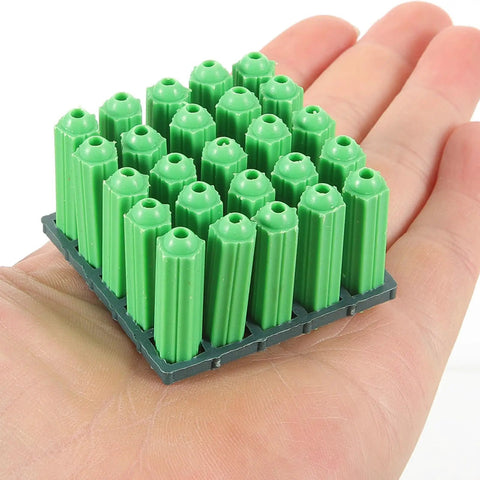 Green Plastic Drywall Anchor Kit With Self Tapping Screws held in hand showing size and detail