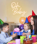 Custom Neon Sign For Any Party Oh Baby Warm White LED Neon Light Bachelorette Party Decor with smiling family at table