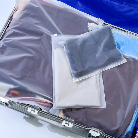 20 Pcs Travel Storage Bags Set For Clothes Cosmetics Shoes Reusable Frosted Ziplock Pouches displayed in a suitcase