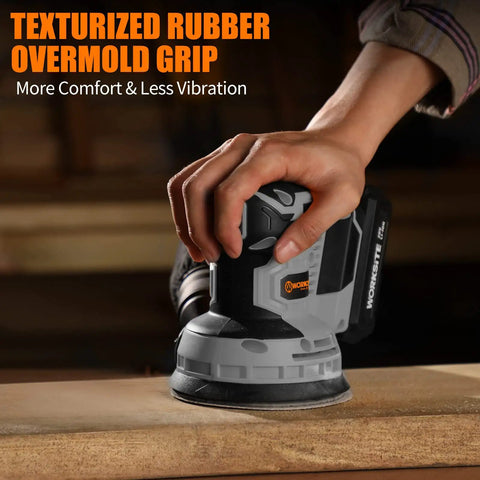 Hand using 20V Max Cordless Random Orbital Sander 5 Inch Variable Speed Hand Sander with 2Ah Battery, sanding wood surface.