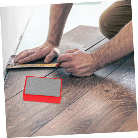 Man using Handheld Diamond Sanding Pads For Ceramic Tiles And Marble Polishing Rock Stone Edge Trimming Block Kit on floor