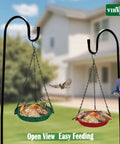 Hanging Bird Feeder For Outdoors 9 Inch Metal Mesh Tray Platform Perfect For Finches Chickadees Sparrows And Other Small Birds Green Backyard Feeder With Minimal Seed Waste And Easy Clean Design, showing feeder hanging outside with birds feeding.
