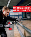 Man using Cordless Rivet Gun Tool For M18 18V Battery Systems on metal sheet, showcasing compact design and 2248 lbf pulling force.