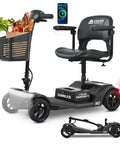 Black M2 mobility scooter with front grocery basket and phone mount on adjustable tiller; folded spare unit shown.