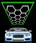 Geometric Hexagon LED Shop Light For Garage And Workshop Ultra Bright High Output Lighting For Car Detailing And Home Gym 14 Hex Grid Panels In Green Wide Coverage AC 100 To 240V Energy Efficient Easy Install Durable Construction illuminating a blue car