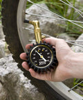 JACO Elite tire pressure gauge with brass body used to measure bicycle tire pressure (100 psi).