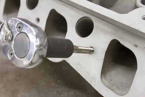Tap Socket Set For Tight Spots Eight Piece Set Fits MC TI Standard Taps Through One Half Inch Also Fits One Eighth Inch NPT And Twelve Millimeter Metric Taps Ideal For Restricted Areas And Hard To Reach Fasteners in use on machinery