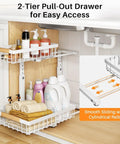 Super Sturdy Two Tier Under Sink Organizer With Adjustable C Shape Base And Smooth Pull Out Rollers displaying two-tier pull-out shelf filled with cleaning supplies and towels.