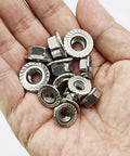 Hand holding stainless steel nuts from Beefy 240 Piece M5 M6 M8 Flanged Bolts And Nuts Set In Stainless Steel 304 Includes 14 Common Sizes For DIY Projects Automotive Machinery And Home Repairs Ready.
