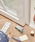 Heavy Duty Door Pulley And Sliding Roller Featuring Dual Copper Wheels Plus Precision Ball Bearings For Quiet Window And Patio Door Replacement Hardware That Works Like A Charm beside a window during installation.