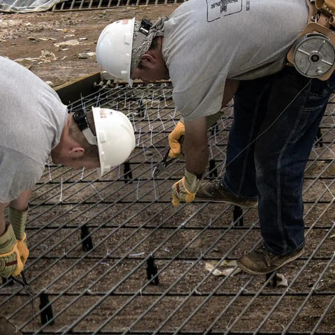 Workers tying rebar on construction site using Tie Wire Reel for 12 to 18 Gauge Wire, Lightweight Aluminum Construction, Made in USA, Left or Right Hand Use, Large Rewind Knob, Feeds Precoiled Wire Smoothly, Rugged and Portable for Quick Wire Runs