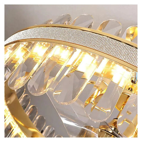 Close-up of modern LED crystal ceiling fan light showcasing art deco design and warm white light elements.