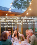 People enjoying a meal under Ultra Long G40 Outdoor String Lights 200Ft With 105 Shatterproof LEDs 5 Spare Waterproof Patio Lighting
