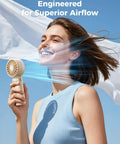 Woman using Powerful Portable Handheld Fan For On The Go With 20 Hour Max Battery Life, 3 Modes, 5 Speed Settings, in beige, outdoors