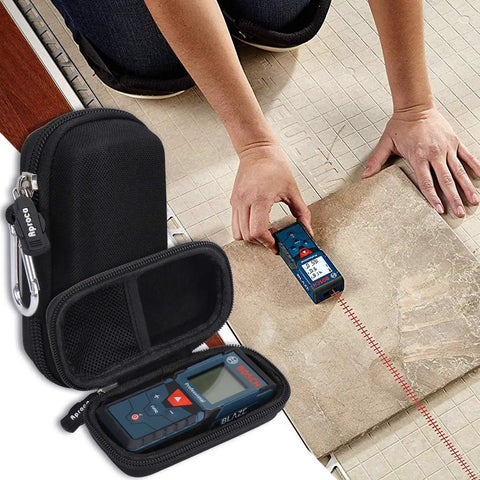 Person using Bosch Blaze Pro 165 Ft Laser Measure Case Only With Durable Portable Storage Bag on tile floor.