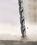 Close-up of Carbide Tipped Percussion Masonry Hammer Drill Bit 5/16 x 6 in for corded and cordless drills with dust removal flutes.