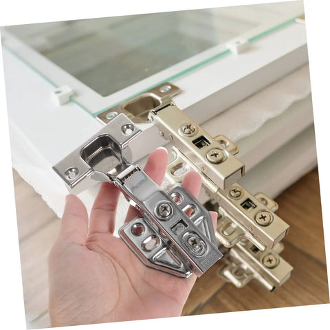 Rock Solid Stainless Steel Concealed Cabinet Hinges With Slick Silent Soft Close Self Closing Design For Kitchen Cupboards featuring a hand holding one hinge.