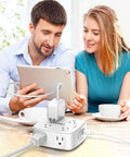Couple using a tablet with Heavy Duty Surge Protector Power Strip With Six Foot Cord And Eight Wide Outlets Plus Four Fast Charge Usb Ports.