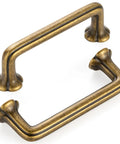 10 Pack 3 Inch Hole Centers Antique Brass Cabinet Pulls Vintage Brass Handles For Cabinets Drawers Dressers Bedroom Vanities Closets Kitchen Hardware Heavy Duty Rustic Finish showing two angled antique brass pulls
