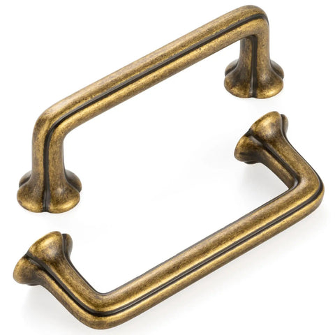 10 Pack 3 Inch Hole Centers Antique Brass Cabinet Pulls Vintage Brass Handles For Cabinets Drawers Dressers Bedroom Vanities Closets Kitchen Hardware Heavy Duty Rustic Finish showing two angled antique brass pulls