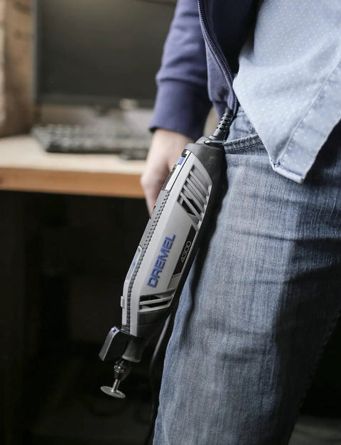 Person holding Dremel-style tool with Keyless Drill Chuck Collet Set For Rotary Tools 1/32 to 1/8 inch shank quick change adapter.