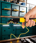 Heavy Duty Precision Stainless Steel Cable Straightener For Electricians in use, straightening yellow wire in a workshop.